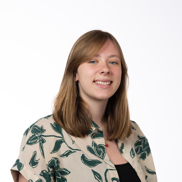 Human with blonde hair and leaf-patterned shirt.